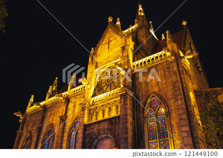 medieval Catholic cathedral in European style in Ba Na Hills Park in Da Nang in Vietnam at night medieval Catholic cathedral in European style in Ba Na Hills Park in Da Nang in Vietnam at night 121449100