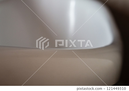 Rounded white bathtub edge for safe bathing, getting in and out of the bathtub. Exclusion of injuries during the use of household items, home recreation in everyday life 121449310