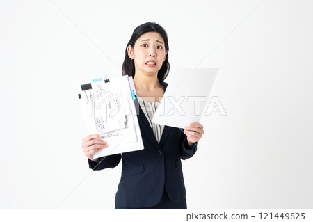 A woman in the accounting department is worried about her expense report 121449825