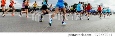 large group runners running city marathon large group runners running city marathon 121450075