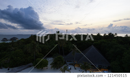 Top view of the sunset over an island in the ocean Top view of the sunset over an island in the ocean 121450515