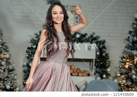 Elegant Woman Celebrating Christmas Eve. 121450600