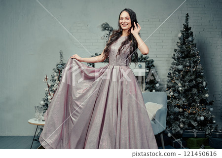 Graceful Woman in Glittering Holiday Dress. 121450616