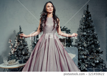 Graceful Woman in Sparkling Holiday Atmosphere. 121450622