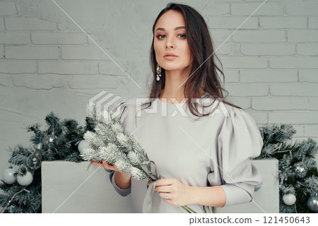 Sophisticated Woman Holding Frosted Branches. Sophisticated Woman Holding Frosted Branches. 121450643