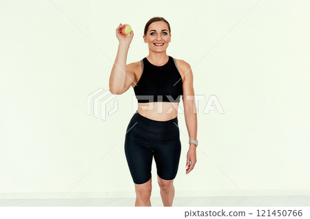 Fitness Trainer Holding Tennis Ball. 121450766