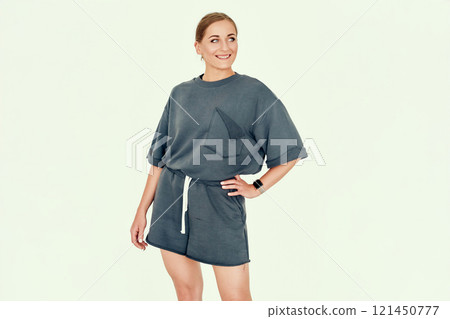 Confident Fitness Trainer in Casual Outfit with Hands on Hip Confident Fitness Trainer in Casual Outfit with Hands on Hip 121450777