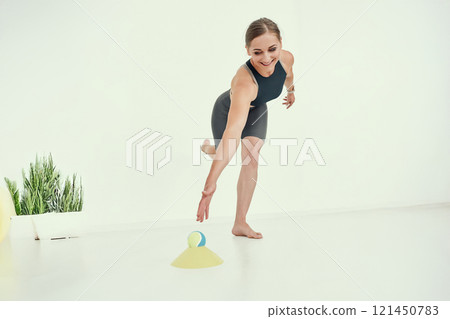 Balance and Coordination Exercise by Fitness Trainer. Balance and Coordination Exercise by Fitness Trainer. 121450783