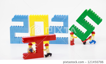 workers set up the new year 2025 wording 121450786