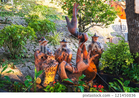 Antique clay jugs and vases decorate Asian garden in Asia in summer Antique clay jugs and vases decorate Asian garden in Asia in summer 121450836