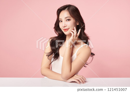 Beautiful young asian woman with clean fresh skin on pink background, Face care, Facial treatment, Cosmetology, beauty and spa, Asian women portrait. 121451007