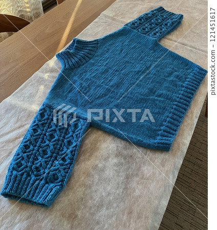Hand-knitted sweater, Aran pattern, knitting with needles Hand-knitted sweater, Aran pattern, knitting with needles 121451617