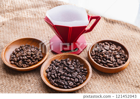 Coffee beans and red dripper Coffee beans and red dripper 121452043