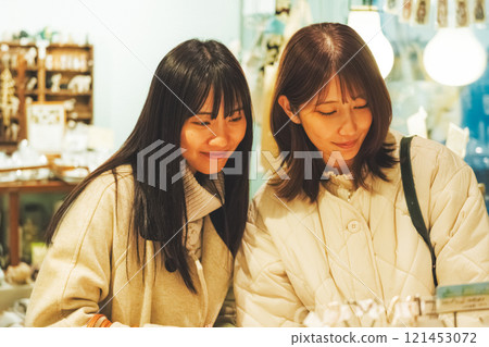 A woman enjoying shopping [Photo courtesy of Nuttari Terrace Shopping Street] 121453072
