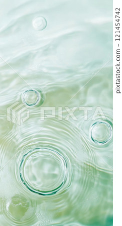 Ripples in clear blue water with abstract circular patterns, suitable as calming SPA background 121454742