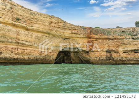 Majestic Coastal Cliffs and Sea Caves in Algarve, Portugal. 121455178