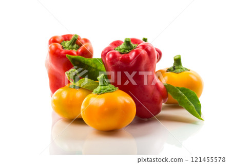 ripe red and yellow sweet peppers. ripe red and yellow sweet peppers. 121455578