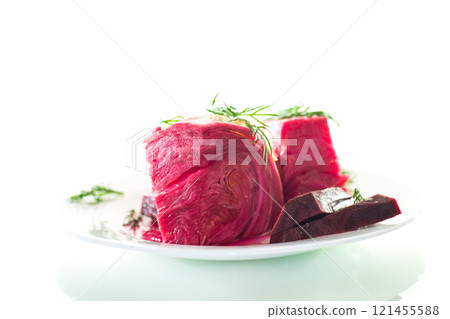 pickled cabbage with beets and carrots, in a plate, isolated on white background 121455588