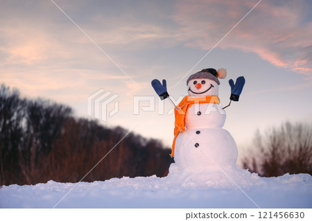 Smiley snowman in knitted hat 121456630