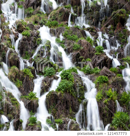 Seamless waterfall background. A repeating pattern with a stream and grass.  121457773
