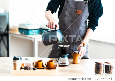 Man enjoying authentic coffee at home (no face) Man enjoying authentic coffee at home (no face) 121458061