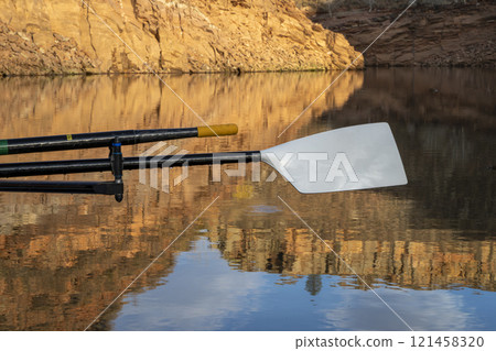 oars of coastal sculling shell in sandstone canyon of Horsetooth Reservoir in Colorado in fall scenery 121458320