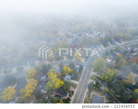 foggy October sunrise over residential street in  Fort Collins in northern Colorado 121458553