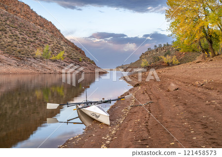 rowing shell on shore of Horsetooth Reservoir in northern Colorado, October scenery rowing shell on shore of Horsetooth Reservoir in northern Colorado, October scenery 121458573