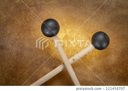 rubber xylophone mallets against backlit drum goat skin rubber xylophone mallets against backlit drum goat skin 121458707