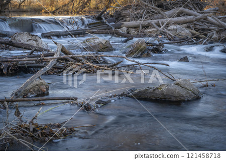 water diverssion dam on the Poudre River in Fort Collins, Colorado, late fall scenry water diverssion dam on the Poudre River in Fort Collins, Colorado, late fall scenry 121458718