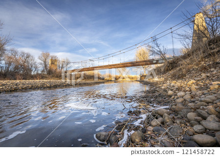 Old abandoned aqueduct suspended across the Poudre River in Fort Collins, Colorado - Great Western Sugar Company Effluent Flume and Bridge Old abandoned aqueduct suspended across the Poudre River in Fort Collins, Colorado - Great Western Sugar Company Effluent Flume and Bridge 121458722