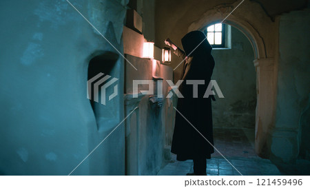 Mysterious man explores ancient church 121459496