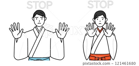 A shrine priest and shrine maiden thrust their hands out in front of them to signal to stop 121461680