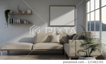 A cozy, minimalist beige living room featuring a large white sofa and minimalist home decor. 121462191