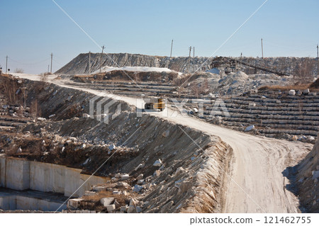 Marble quarry. A dumper rides in a career Marble quarry. A dumper rides in a career 121462755