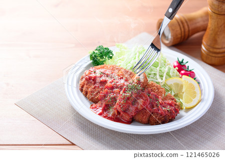 Pork cutlet with tomato sauce 121465026