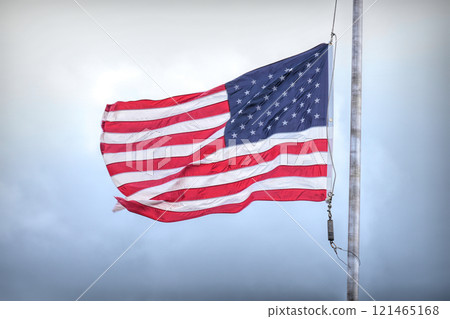Waving American Flag Against Cloudy Sky Waving American Flag Against Cloudy Sky 121465168