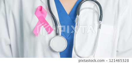 Pink October Breast Cancer Awareness month, woman doctor with pink Ribbon in hospital for support people life and illness. National cancer survivors month, Mother and World cancer day concept Pink October Breast Cancer Awareness month, woman doctor with pink Ribbon in hospital for support people life and illness. National cancer survivors month, Mother and World cancer day concept 121465328