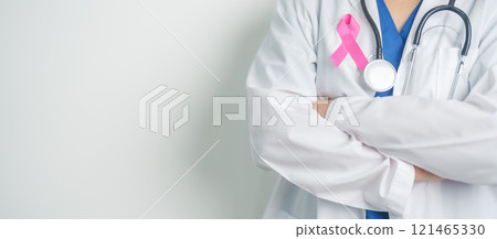Pink October Breast Cancer Awareness month, woman doctor with pink Ribbon in hospital for support people life and illness. National cancer survivors month, Mother and World cancer day concept 121465330