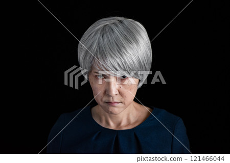Dissatisfied senior woman 121466044