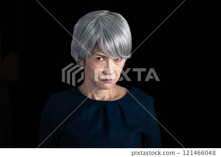 Glaring senior woman 121466048