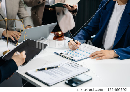 business people and lawyers discussing contract papers sitting at the table. Concepts of law 121466792