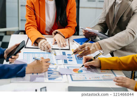 Business team meeting present.professional investor working with Finance managers task. with laptop smart phone and digital tablet Business team meeting present.professional investor working with Finance managers task. with laptop smart phone and digital tablet 121466844