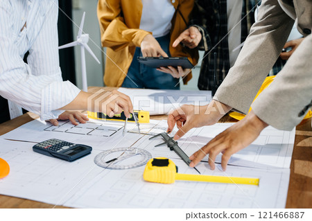 Creative architect projecting on the big drawings with architectural project Creative architect projecting on the big drawings with architectural project 121466887