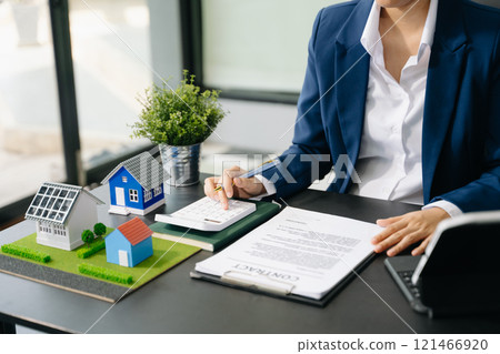 Considering buying a home, investing in real estate. Broker signs a sales agreement. agent, lease agreement, successful Considering buying a home, investing in real estate. Broker signs a sales agreement. agent, lease agreement, successful 121466920
