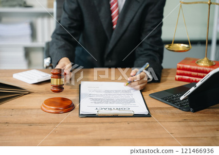 Justice and law concept.Male judge in a courtroom on white table and Counselor or Male lawyer working Justice and law concept.Male judge in a courtroom on white table and Counselor or Male lawyer working 121466936