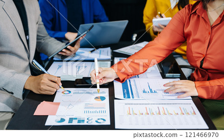 Business people making presentation with his colleagues and business smartphone, tablet digital computer 121466970