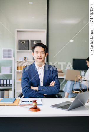 Asian man lawyer working and gavel, tablet, laptop in front, Advice justice and law concept. Asian man lawyer working and gavel, tablet, laptop in front, Advice justice and law concept. 121467026