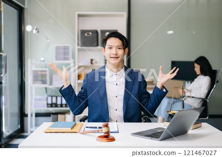 Asian man lawyer working and gavel, tablet, laptop in front, Advice justice and law concept. 121467027