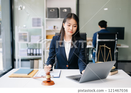 Asian woman lawyer working and gavel, tablet, laptop in front, Advice justice and law concept. Asian woman lawyer working and gavel, tablet, laptop in front, Advice justice and law concept. 121467036